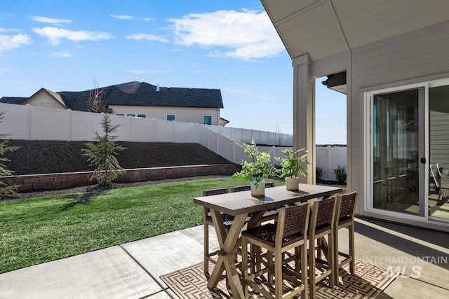 view of patio / terrace featuring outdoor dining area and a fenced backyard