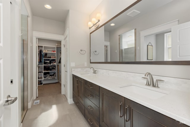 6178 N Bolsena Ln, Meridian, ID 83646 - full bath featuring double vanity, a spacious closet, a shower with door, and recessed lighting