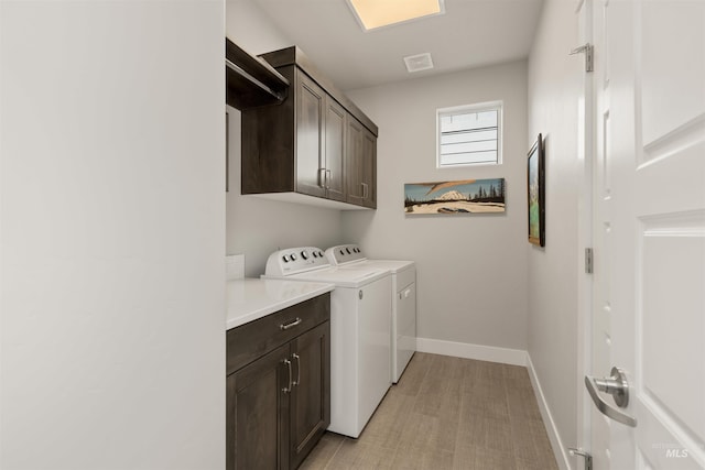 6178 N Bolsena Ln, Meridian, ID 83646 - laundry area featuring cabinet space, washing machine and clothes dryer, and baseboards