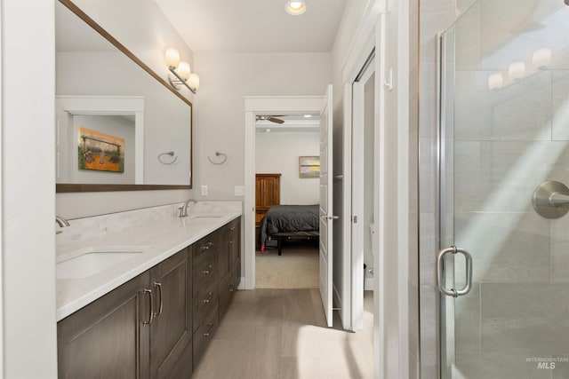 6178 N Bolsena Ln, Meridian, ID 83646 - bathroom with double vanity, a shower stall, connected bathroom, a ceiling fan, and recessed lighting
