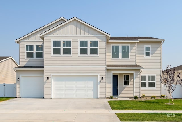 2005 N Spring Creek Ave, Middleton, ID 83644 - view of front of property featuring a garage, concrete driveway, and board and batten siding