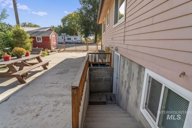 view of side of home featuring a patio area