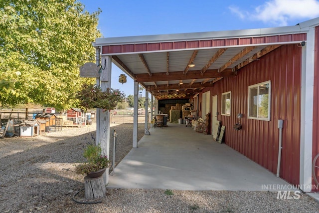 view of vehicle parking featuring a carport