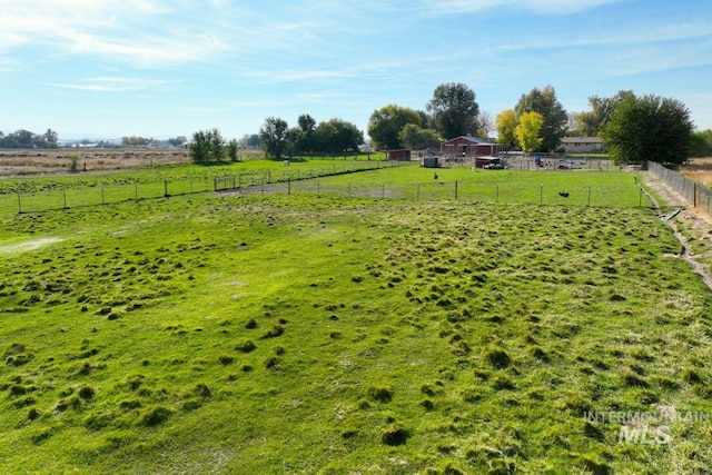 view of yard with a rural view