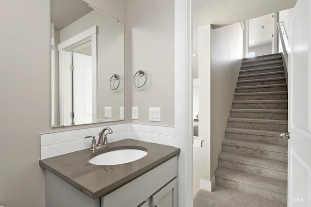 1694 N Solterra Ln, Meridian, ID 83646 - bathroom featuring decorative backsplash and vanity