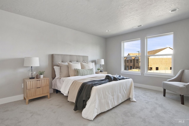 1694 N Solterra Ln, Meridian, ID 83646 - bedroom with a textured ceiling, light colored carpet, baseboards, and visible vents