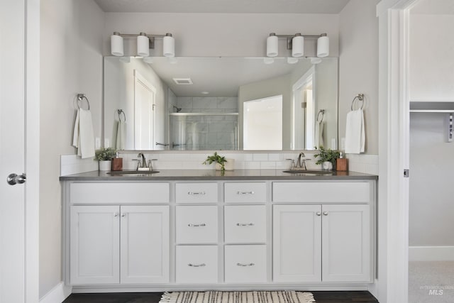 1694 N Solterra Ln, Meridian, ID 83646 - bathroom featuring a sink, visible vents, double vanity, and a stall shower