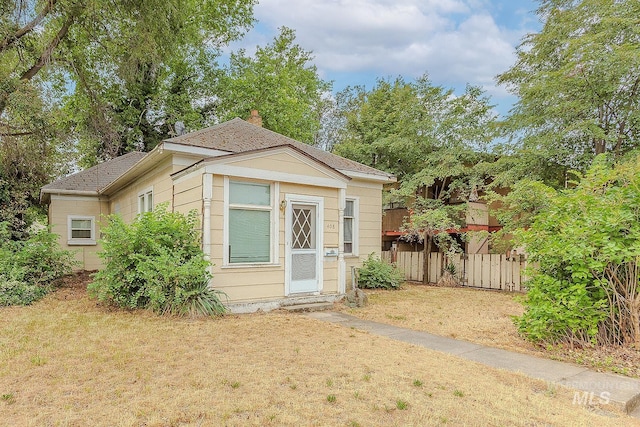408 6th Ave, Lewiston, ID 83501 - view of front of home with a chimney and roof with shingles