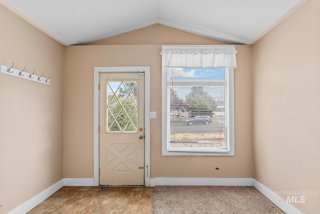 408 6th Ave, Lewiston, ID 83501 - doorway to outside featuring vaulted ceiling and baseboards