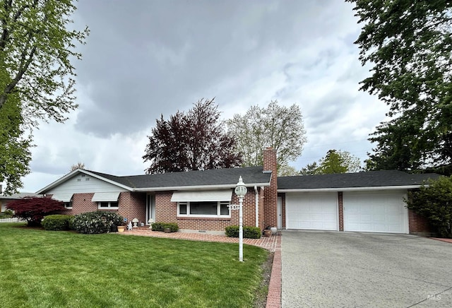 ranch-style house with driveway, a chimney, a front yard, a garage, and brick siding