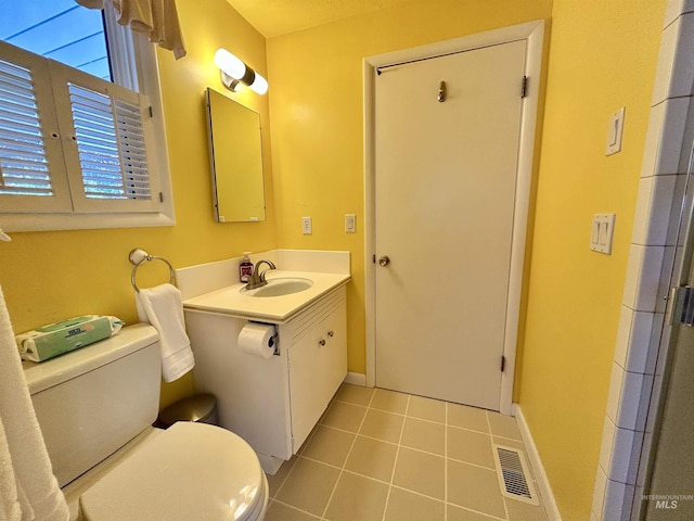 bathroom with tile patterned floors, baseboards, toilet, and visible vents