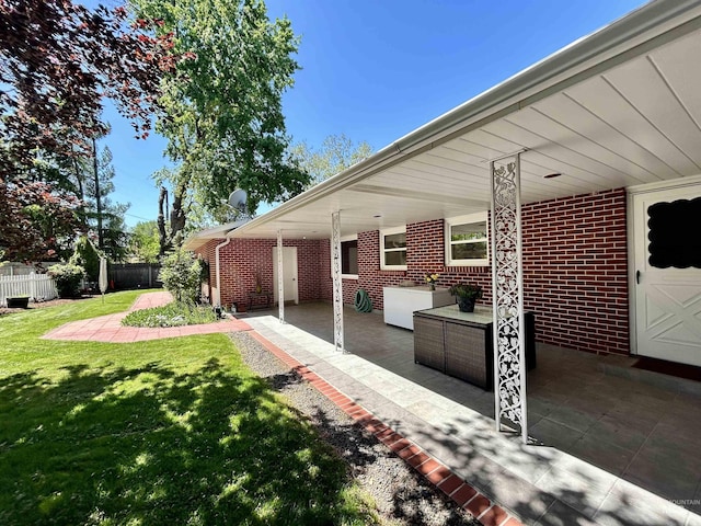 view of patio / terrace featuring fence