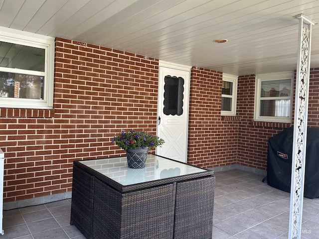 view of patio featuring area for grilling and outdoor dining space