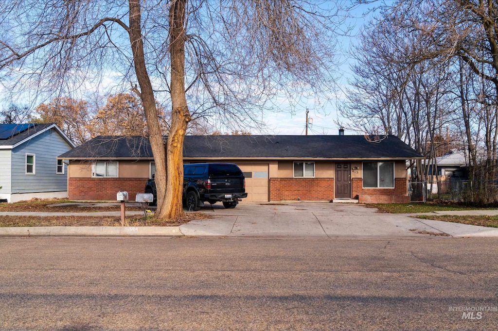 single story home with a garage