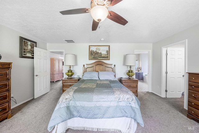 bedroom featuring ceiling fan, dark carpet, and a textured ceiling