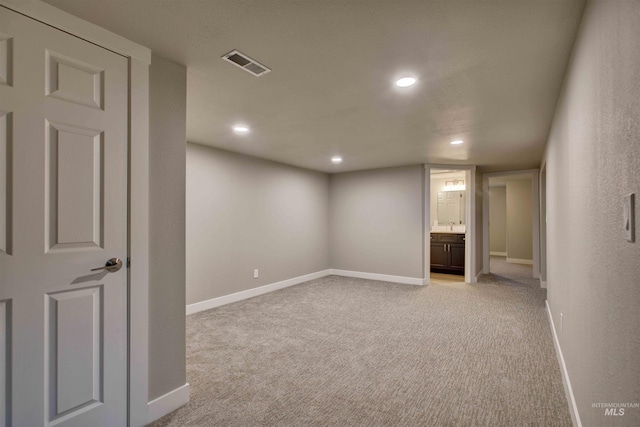 interior space featuring light colored carpet