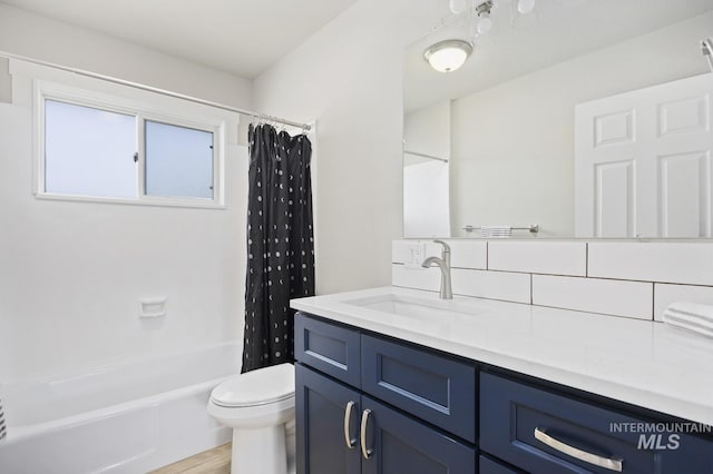 full bathroom with shower / tub combo with curtain, vanity, toilet, and wood finished floors