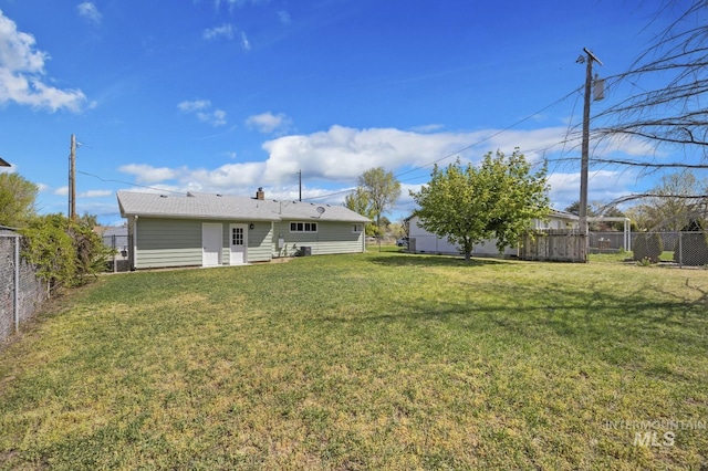 view of yard with a fenced backyard