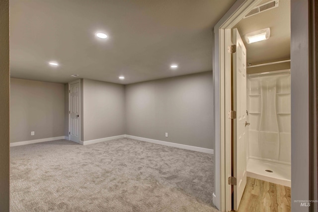 basement with light carpet