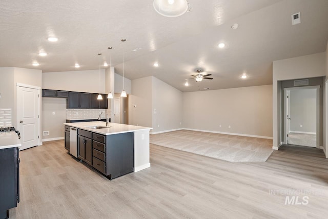 19257 Red Eagle Way, Caldwell, ID 83605 - kitchen featuring a sink, dishwasher, light countertops, ceiling fan, and light wood-style flooring