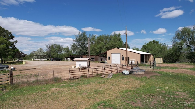 1334 Morehouse Rd, Emmett, ID 83617 - view of yard with a detached garage, an outbuilding, a pole building, and dirt driveway