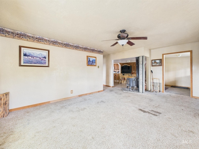 1334 Morehouse Rd, Emmett, ID 83617 - unfurnished living room with carpet, a ceiling fan, and baseboards