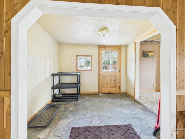 1334 Morehouse Rd, Emmett, ID 83617 - foyer featuring baseboards, a textured ceiling, and stone finish flooring
