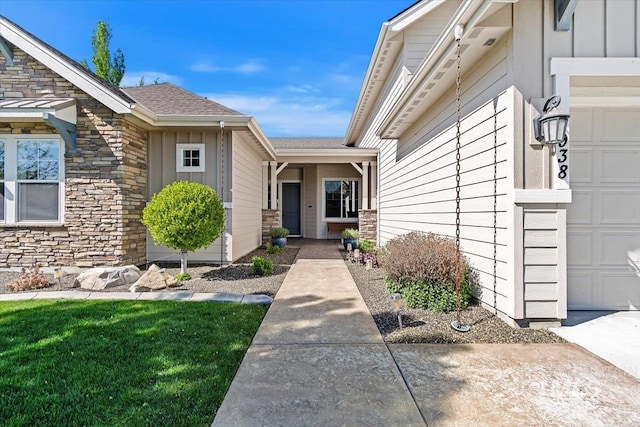 doorway to property featuring stone siding and board and batten siding