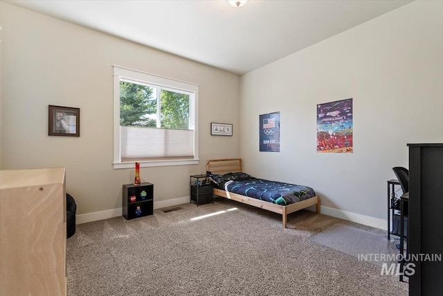 bedroom with carpet and baseboards