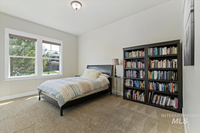 carpeted bedroom with baseboards