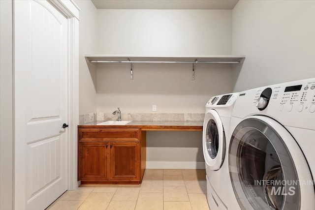 laundry area featuring independent washer and dryer and light tile patterned floors