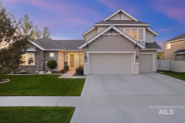 craftsman house with board and batten siding, concrete driveway, a garage, stone siding, and roof with shingles