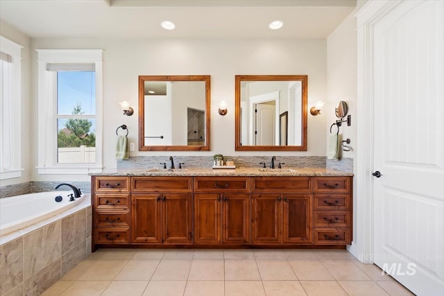 full bathroom featuring tile patterned floors, a bath, double vanity, and recessed lighting