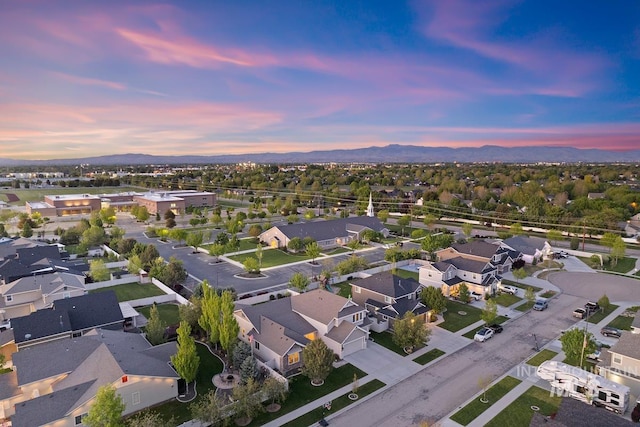 aerial view at dusk of a mountain view and a residential view