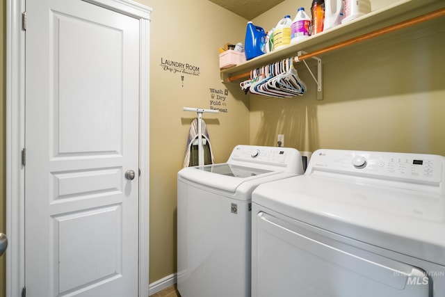 laundry area with independent washer and dryer