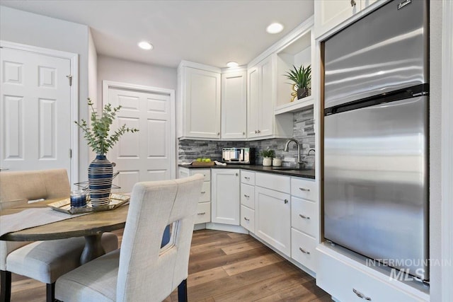 11298 W Charitan St, Boise, ID 83713 - kitchen featuring stainless steel refrigerator, a sink, white cabinetry, dark countertops, and recessed lighting