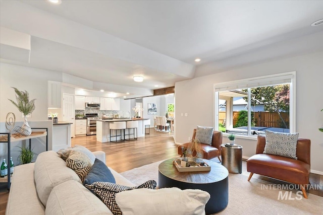 11298 W Charitan St, Boise, ID 83713 - living area featuring light wood-style floors, recessed lighting, and baseboards