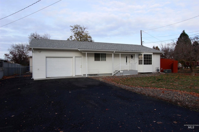 ranch-style house featuring a garage