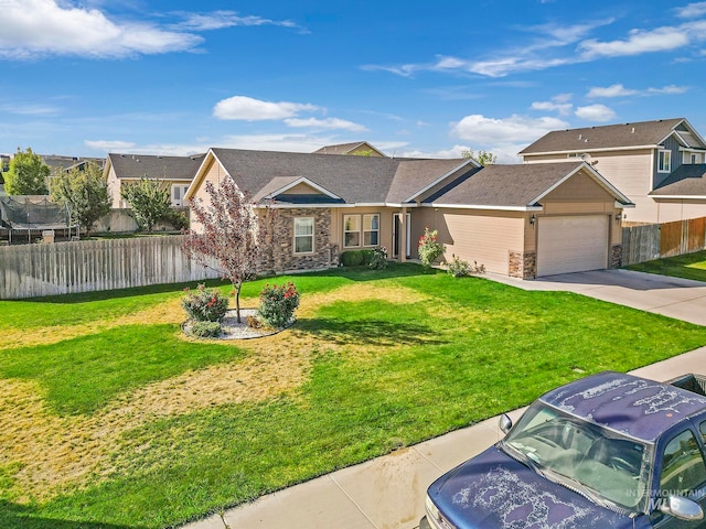 view of front of property featuring a garage and a front lawn