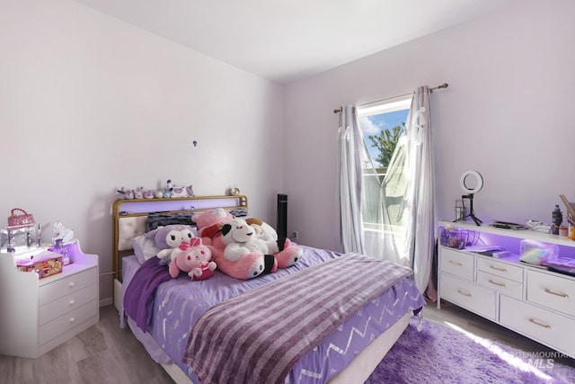 bedroom featuring light wood-style floors