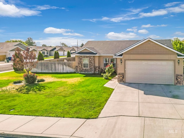 ranch-style home featuring a garage and a front lawn