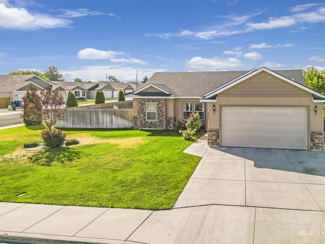 single story home featuring stone siding, fence, concrete driveway, a front yard, and a garage