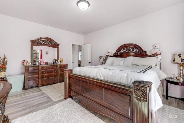 bedroom with light hardwood / wood-style flooring