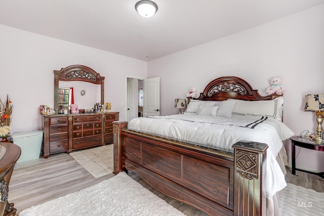 bedroom featuring light wood finished floors