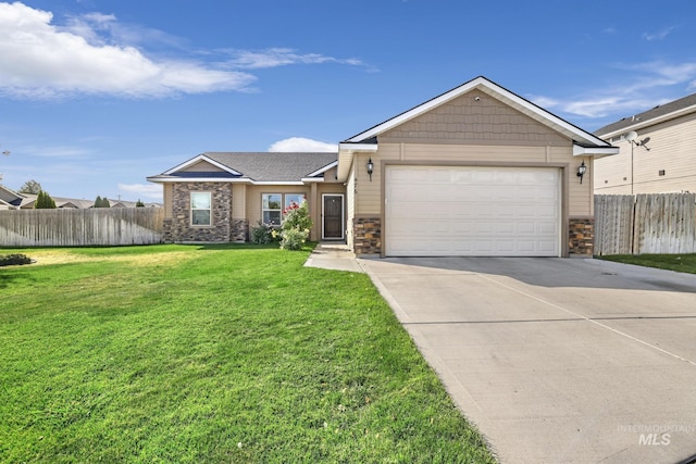 ranch-style home with fence, driveway, an attached garage, a front lawn, and stone siding