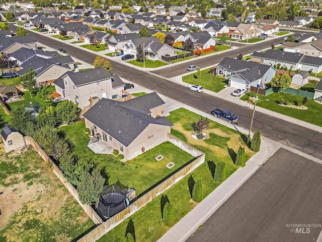 birds eye view of property with a residential view
