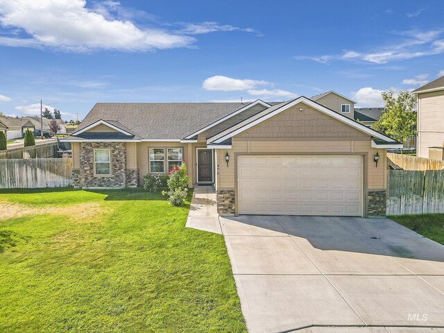 view of front facade with a garage and a front lawn