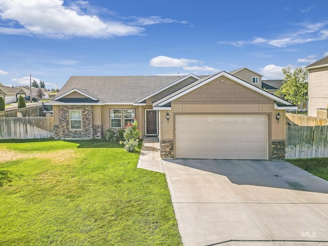 view of front of home with a front yard, fence, an attached garage, concrete driveway, and stone siding
