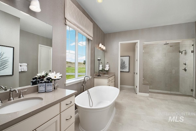 2151 N Mountain Vista Ave, Star, ID 83669 - full bath featuring a stall shower, a freestanding bath, two vanities, baseboards, and tile patterned flooring