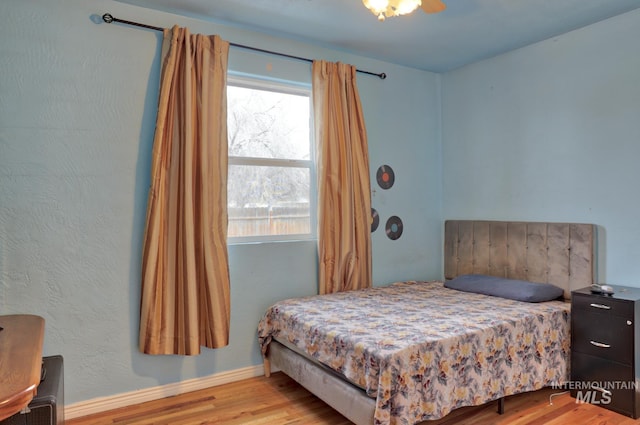 bedroom with light hardwood / wood-style floors